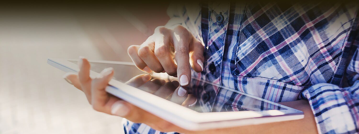 Close up of a woman using a tablet