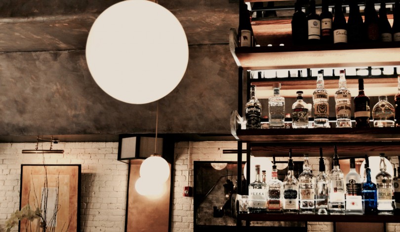 the bar and a spherical light fixture at the restaurant