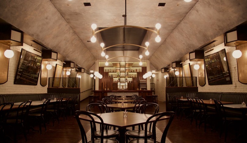 Interior of a restaurant with rows of tables and chairs