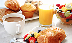 Breakfast items on white table cloth