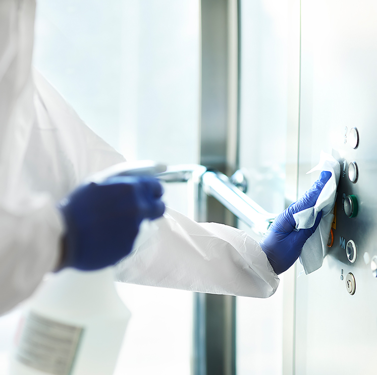person cleaning elevator