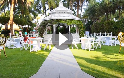 outdoor gazebo with lawn chairs set up for a formal party or wedding 