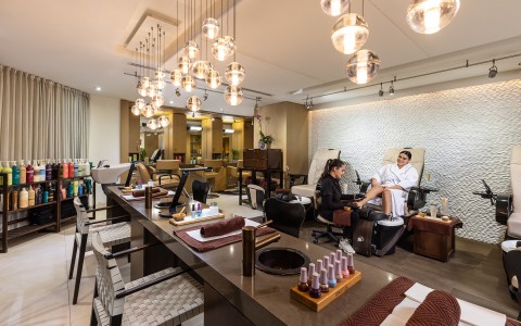 a woman getting a pedicure at the spa