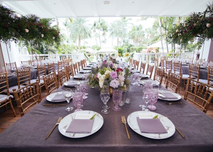 wedding set up with purple glasses and napkins