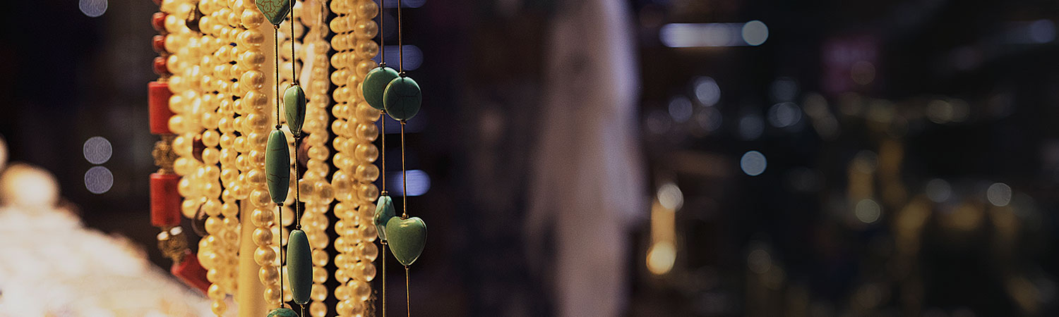 jewelry hanging in front of a store front
