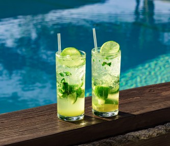 two mojitos by pool