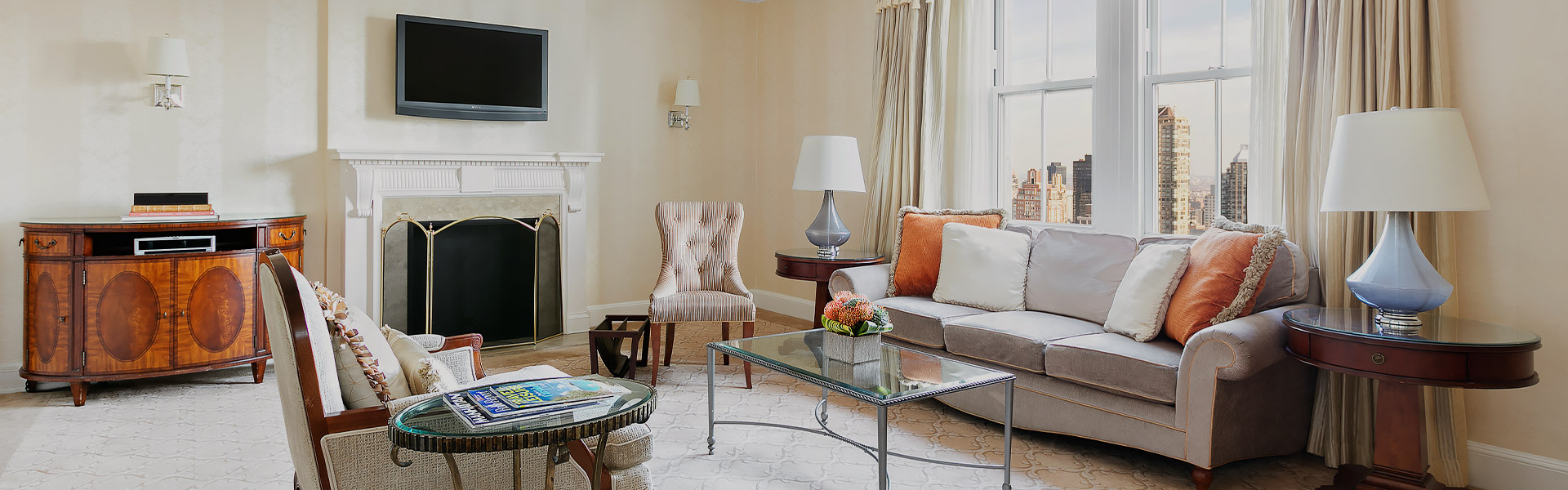 living room with a tv and a fireplace