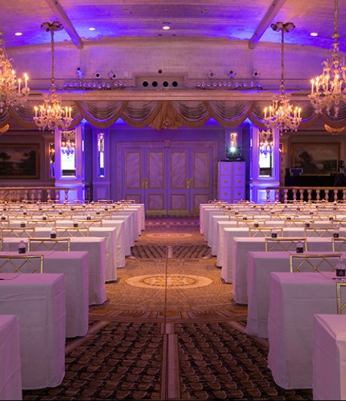 meeting space with tables and chandeliers