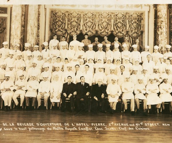 Old photograph of group of people in white