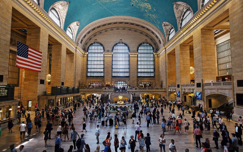 lots of people walking around inside grand central station