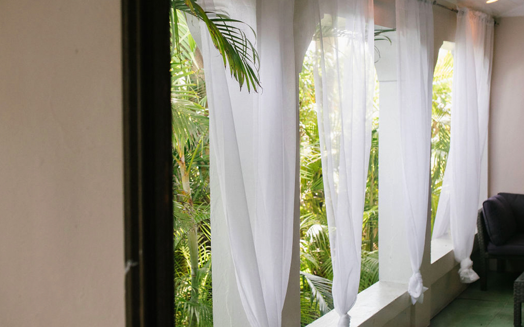 garden view with four white curtains 