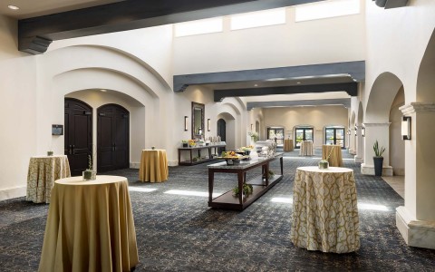 scottsdale plaza hallway with tables through the hall with yellow tablecloth
