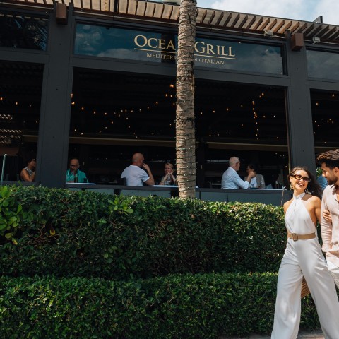 couple walking exterior view of the Ocean Grill restaurant 