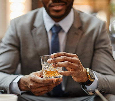 well dressed guy having a fancy cocktail