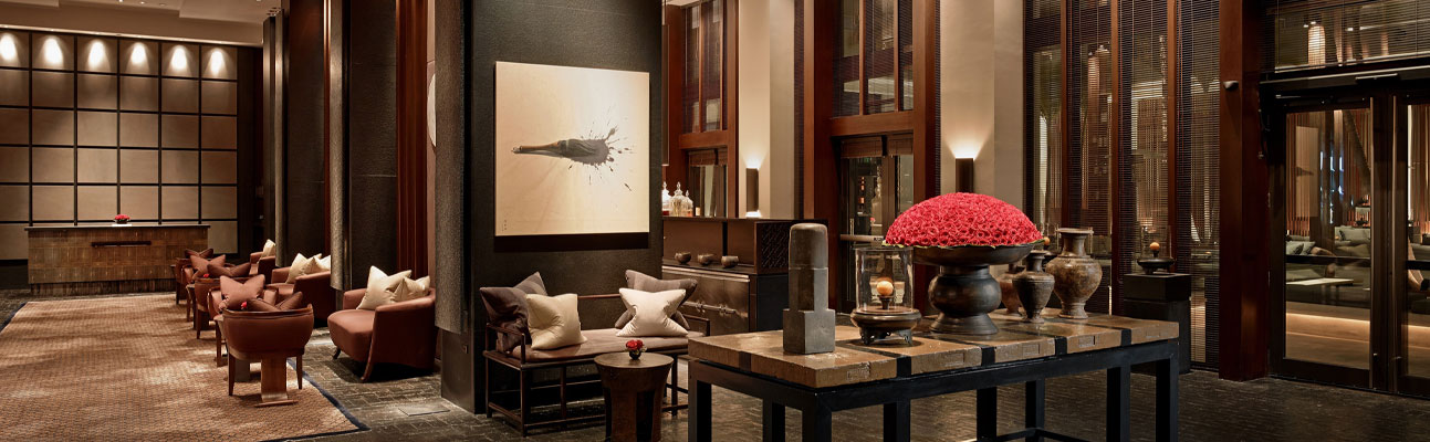 a large room with sofas and artwork on the wall