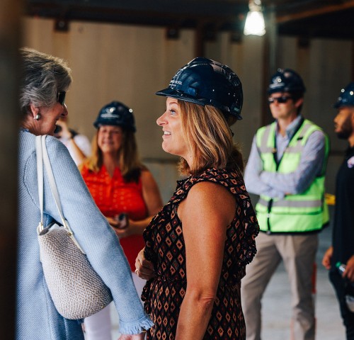women in construction zone talking