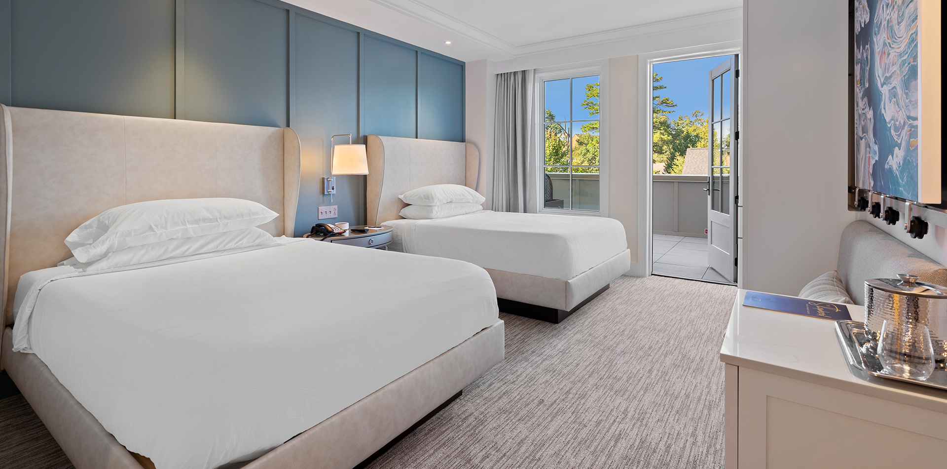 guest room with double queen beds and a terrace