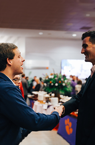 2 men shaking hands