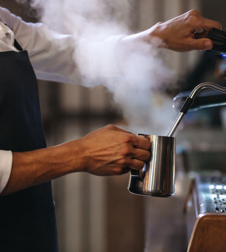 barista steaming milk
