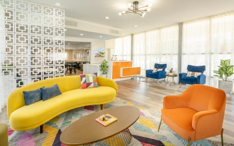 sojourn lobby desk and colorful seating area