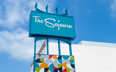 the sojourn hotel blue sign