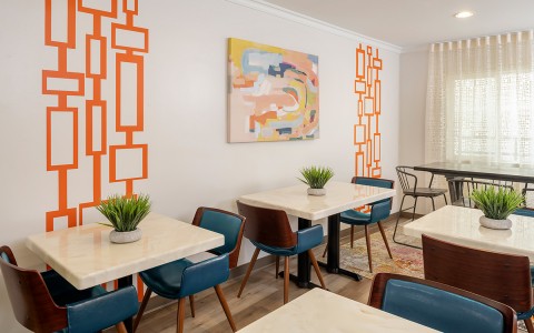 dining area in sojourn with wall art