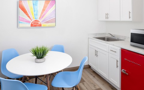 kitchenette with table and blue chairs