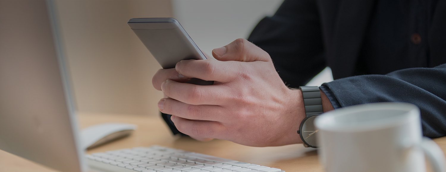 Close up of hands holding cellphone