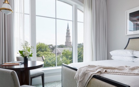 The Spectator bedroom with window overlooking Charleston