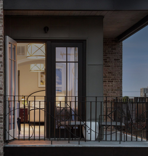 view of Spectator Hotel room from outside at night