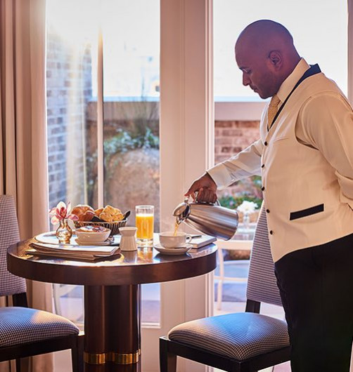Man pouring coffee for breakfast