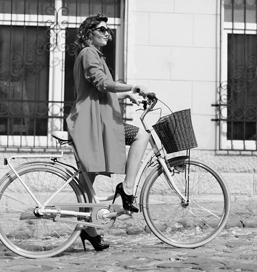 vintage girl riding a bike
