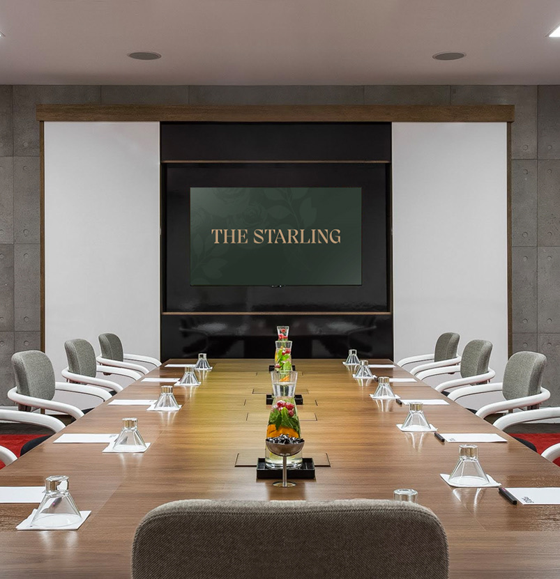 a set up table in a meeting room