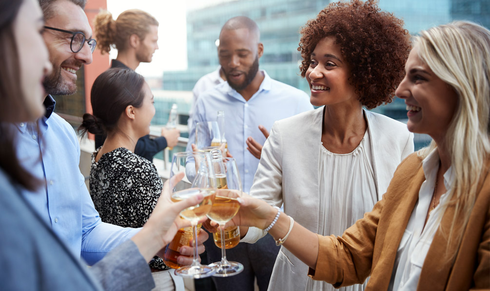 group of people toasting in a terrace