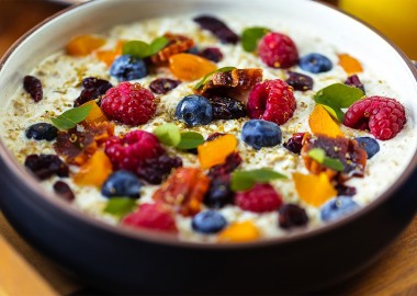 bowl of oats topped with blueberries and raspberries