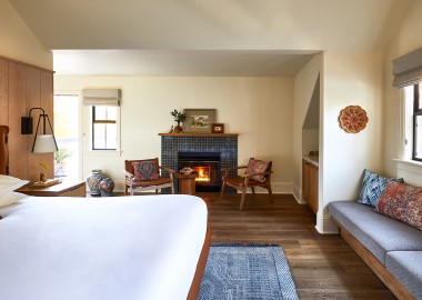 stavrand guest room with bed and fire place