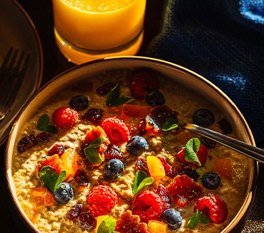 oatmeal fruit and orange juice breakfast