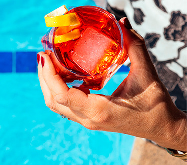 amenities quad summer cocktail being held over the pool
