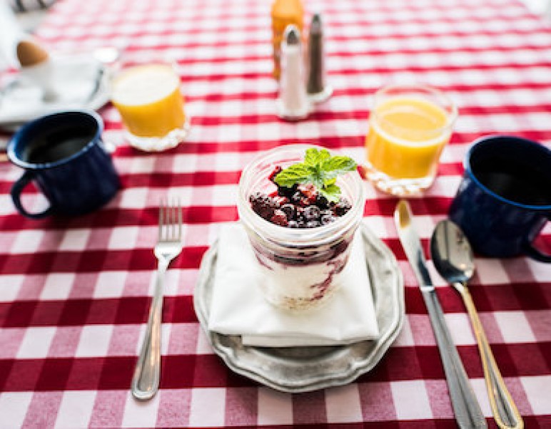 breakfast overnight oats on table with orange juice and coffee