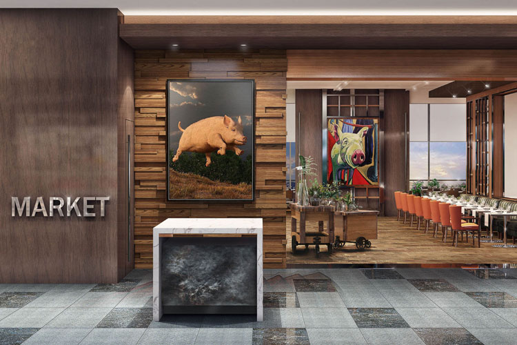 The Market restaurant entrance with podium, pig painting & table