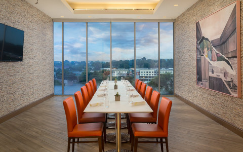 Private dining room with large windows overlooking the city