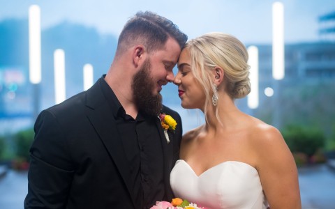 Photo credit to Ben Elsass, a bride and groom smiling at each other