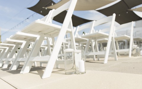 Photo credit to Dan Kinzie, a close up of wedding chairs