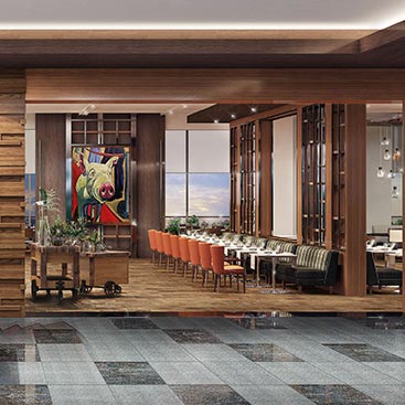 Room with long rectangular table & seating enclosed with glass walls