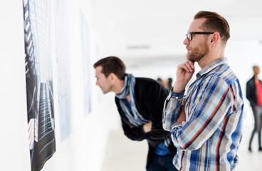 Men looking at art in museum