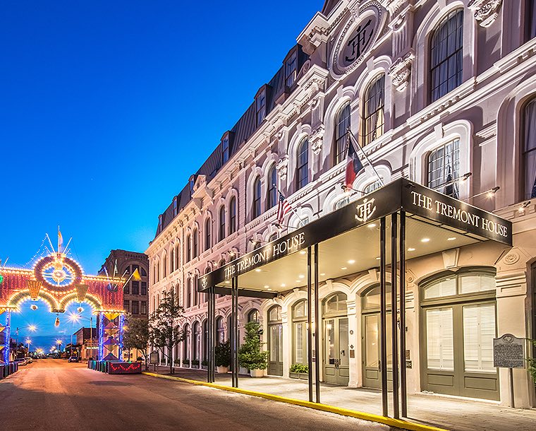 tremont hotel front at night with black awning and pier lights