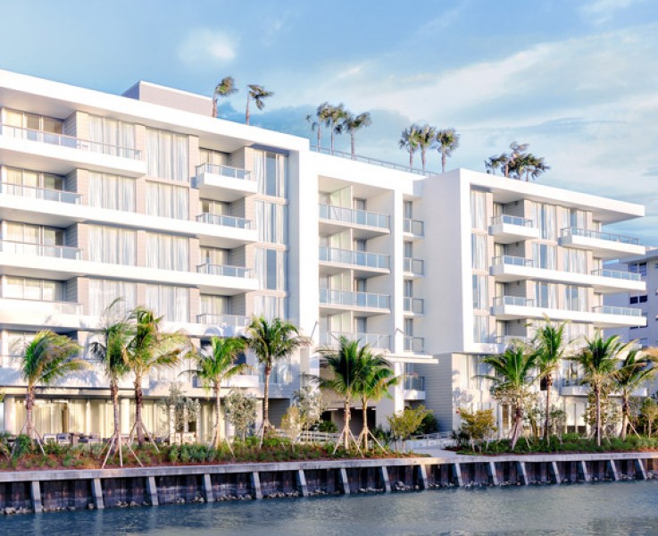 the outside of a hotel on the water