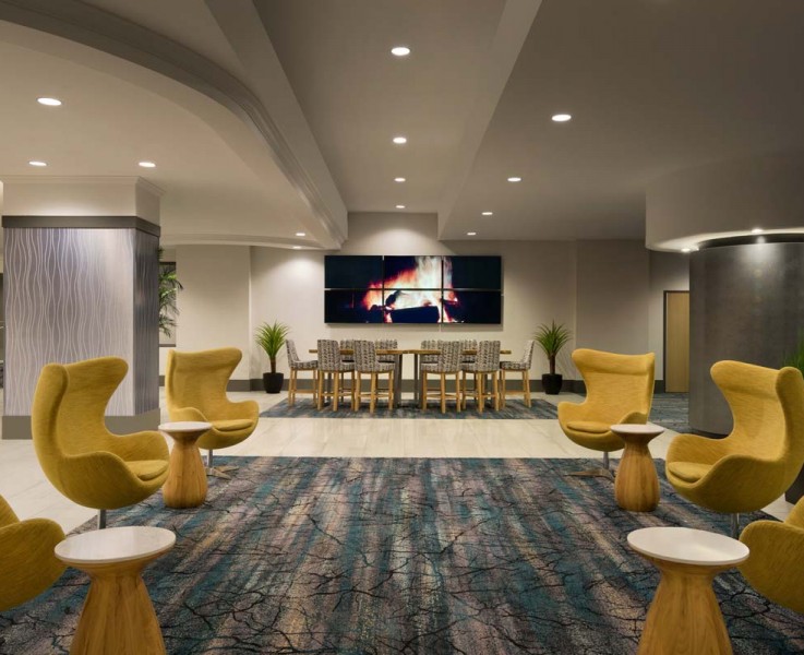 hotel lobby with yellow chairs