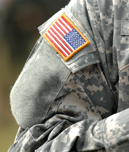 military rate- arm of a soldier showing the USA flag
