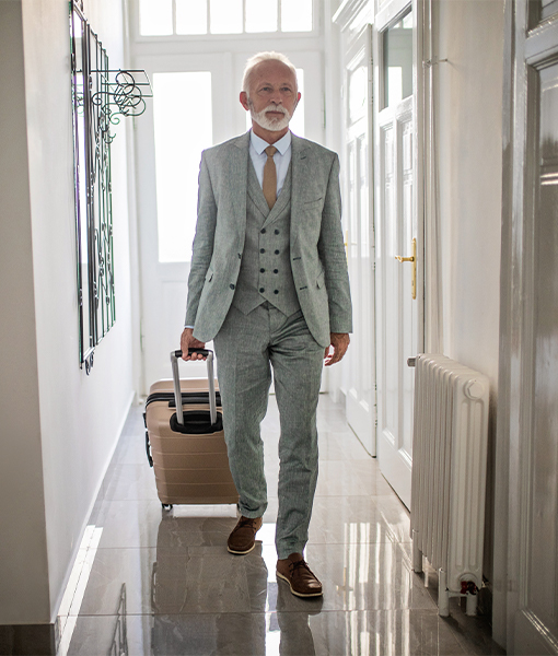 senior man walking with a bag